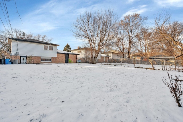 view of yard layered in snow