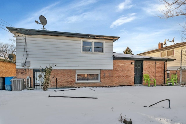 rear view of house with cooling unit