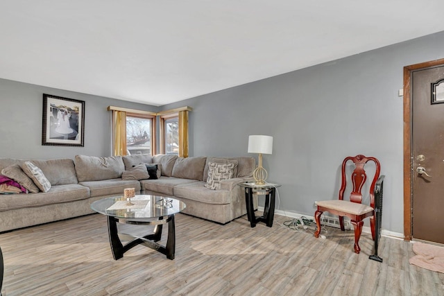 living room with light hardwood / wood-style flooring