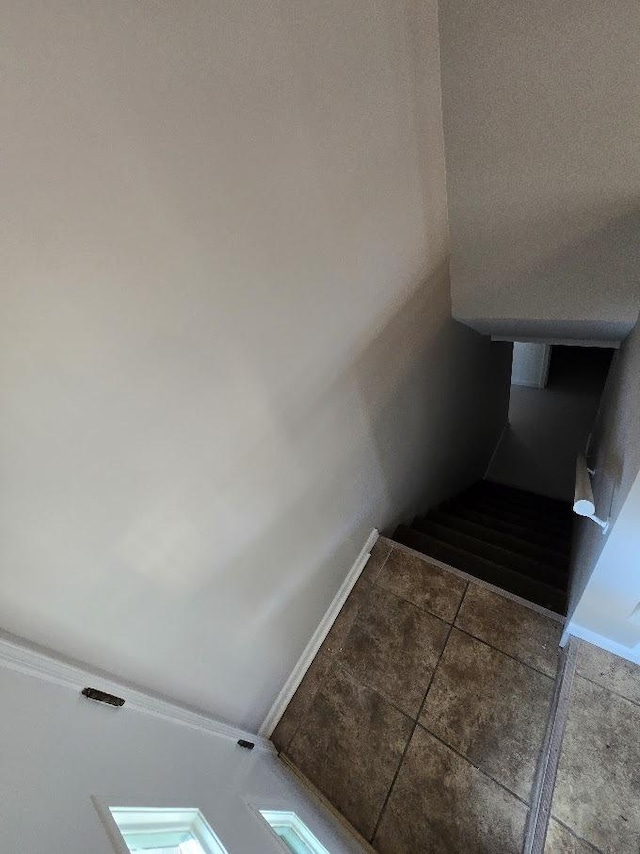 stairway with tile patterned flooring