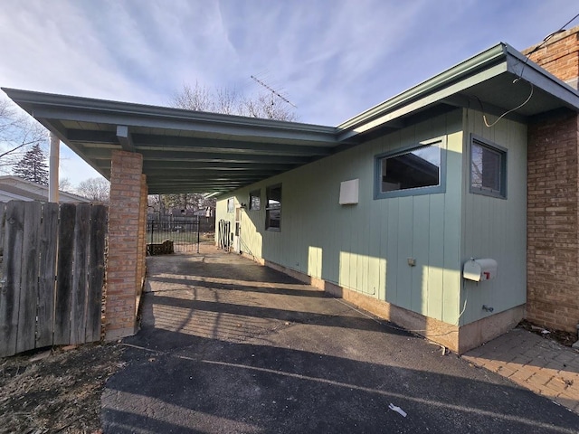 exterior space featuring a carport