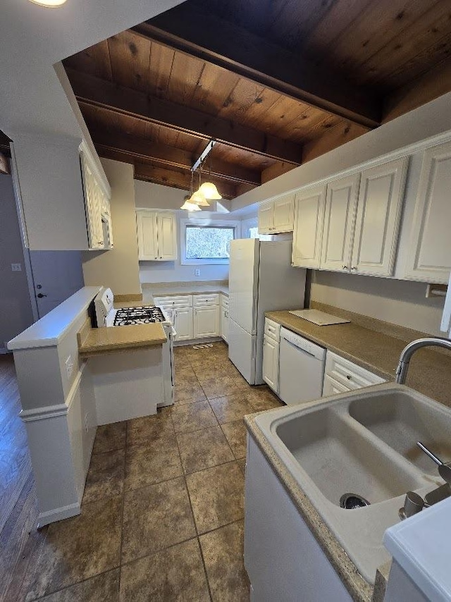 kitchen featuring beamed ceiling, white appliances, hanging light fixtures, and wood ceiling