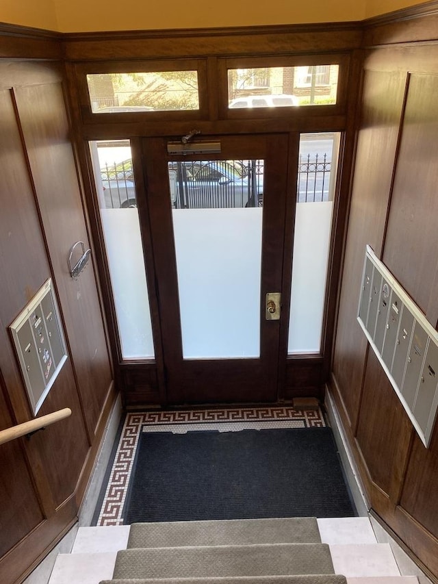 interior space with wood walls and mail boxes