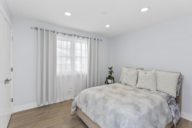 bedroom with hardwood / wood-style flooring