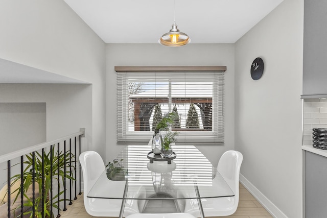 dining room with light hardwood / wood-style flooring