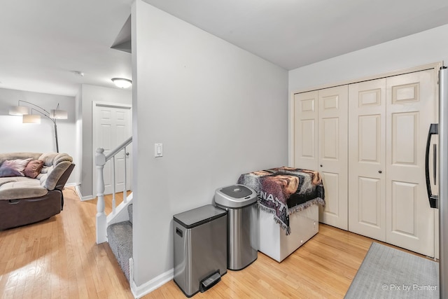 laundry area with hardwood / wood-style floors