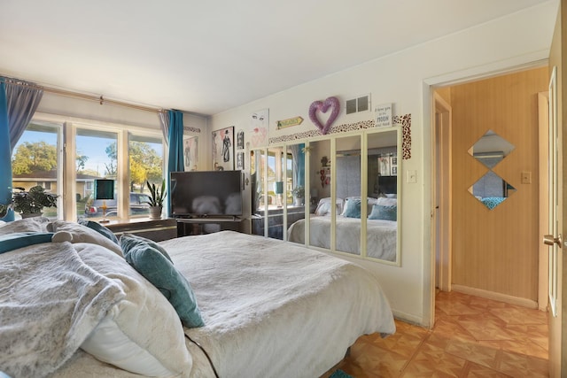 bedroom featuring parquet flooring