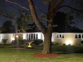 view of front of home with a lawn