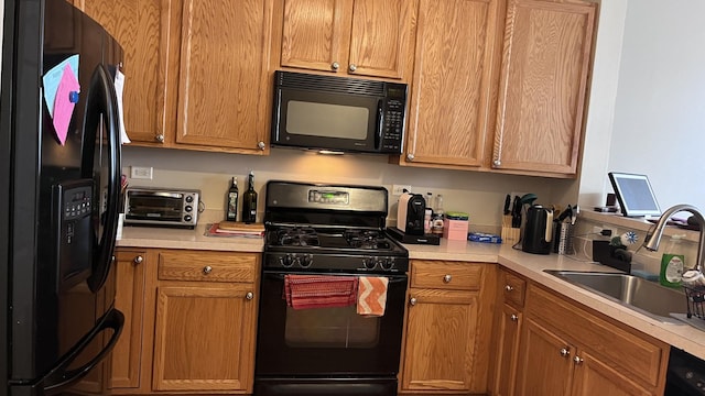 kitchen featuring sink and black appliances