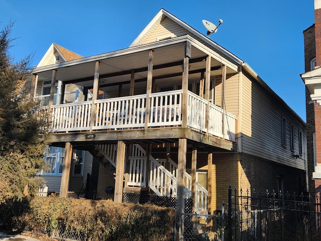 back of property with a wooden deck