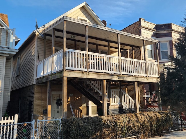 view of front of property with a balcony and a deck