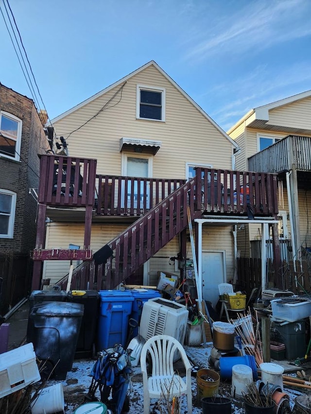 back of property featuring a deck