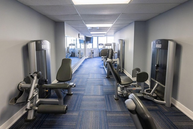 workout area with a paneled ceiling