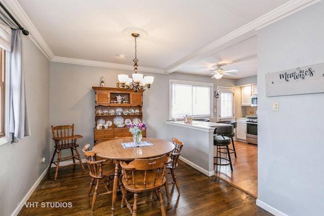 dining area featuring ornamental molding, dark wood-type flooring, and ceiling fan with notable chandelier