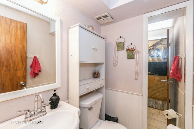 bathroom featuring sink and toilet