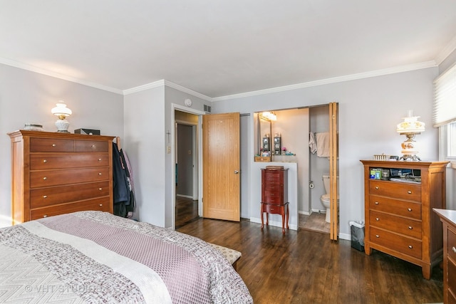 bedroom with dark hardwood / wood-style flooring, ornamental molding, and ensuite bathroom