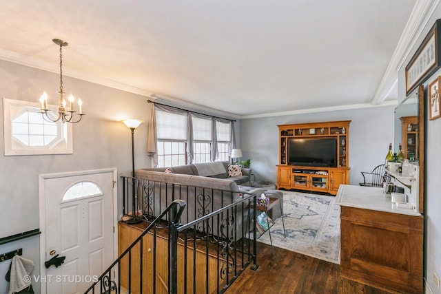 living room featuring a notable chandelier, crown molding, and dark hardwood / wood-style floors