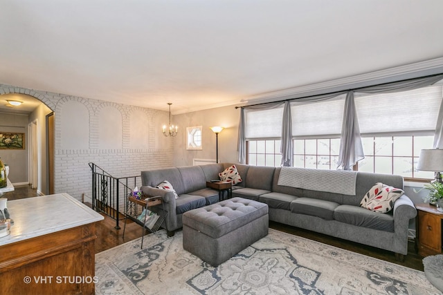 living room featuring a notable chandelier and wood-type flooring