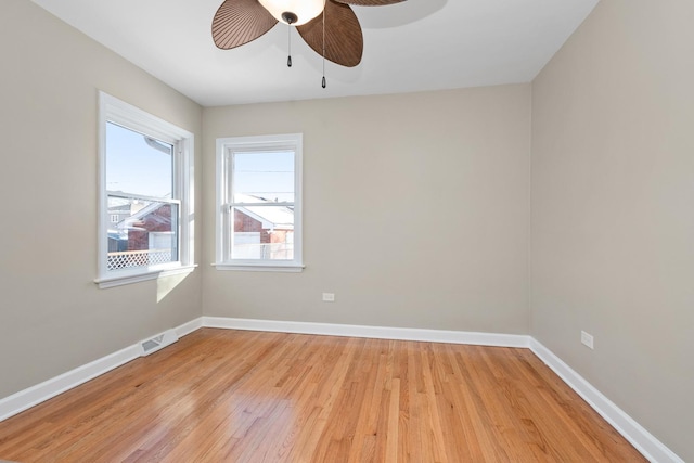 spare room featuring ceiling fan and light wood-type flooring