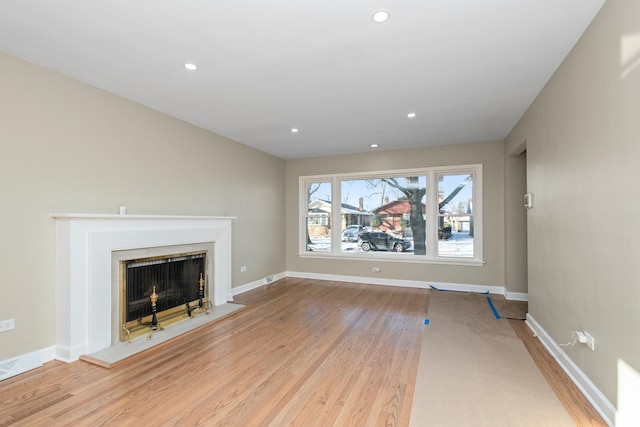 unfurnished living room featuring light hardwood / wood-style floors