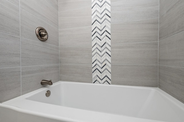 bathroom with a tub to relax in