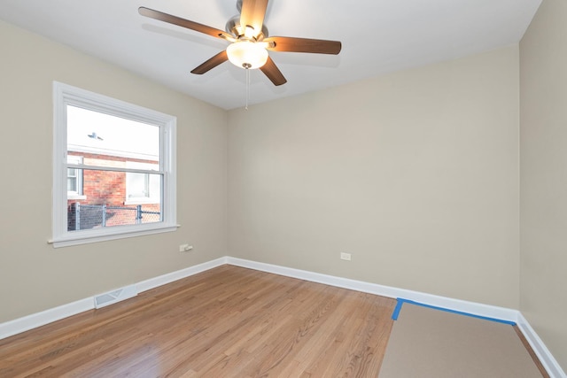 spare room featuring ceiling fan and light hardwood / wood-style floors