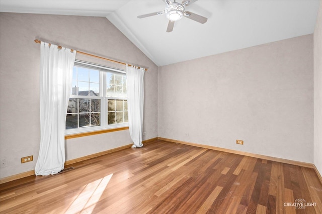 unfurnished room with hardwood / wood-style flooring, ceiling fan, and lofted ceiling