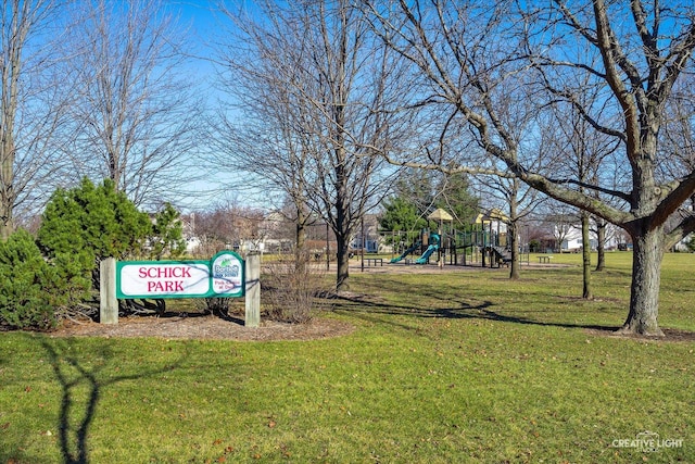 surrounding community with a playground and a yard