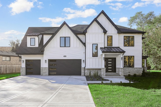 modern farmhouse with a front yard and a garage