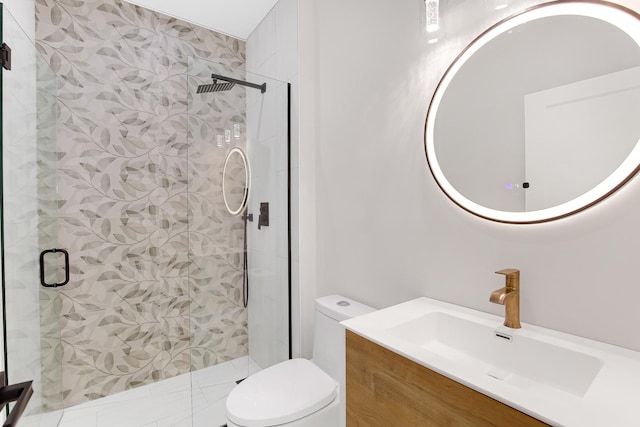 bathroom featuring vanity, an enclosed shower, and toilet