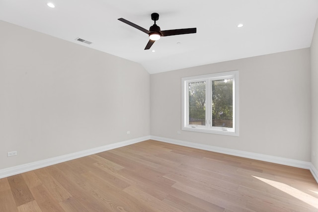 unfurnished room featuring light hardwood / wood-style flooring, ceiling fan, and lofted ceiling