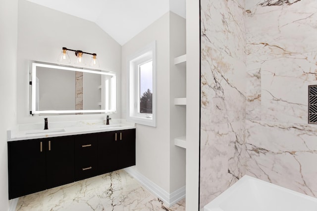 bathroom with built in shelves, vanity, and lofted ceiling