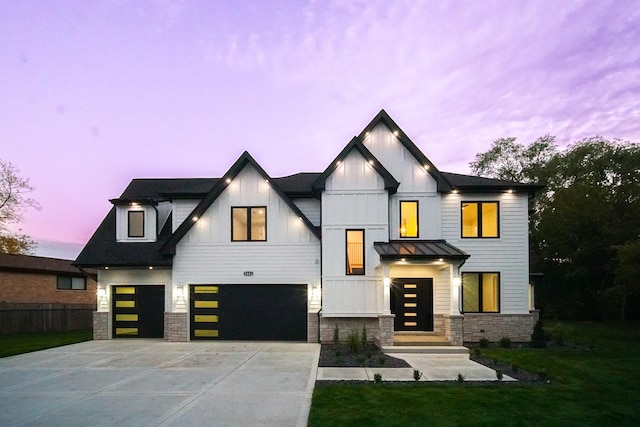 modern farmhouse style home featuring a garage