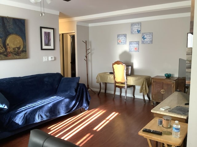 living room with ceiling fan, dark hardwood / wood-style flooring, and ornamental molding