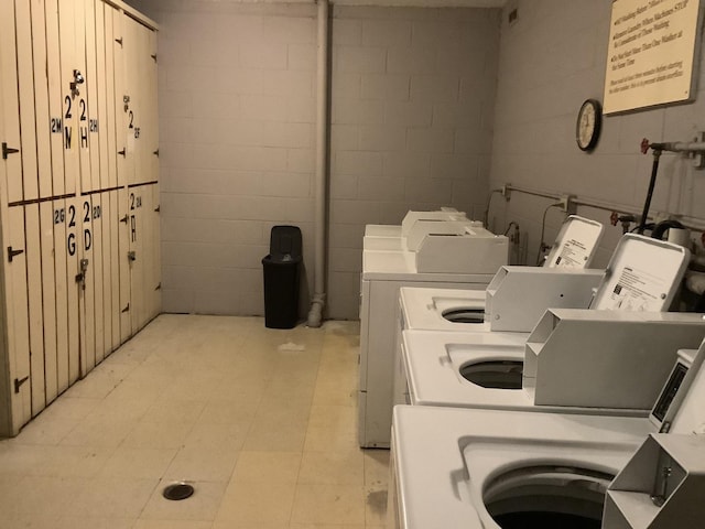 clothes washing area featuring washer and clothes dryer