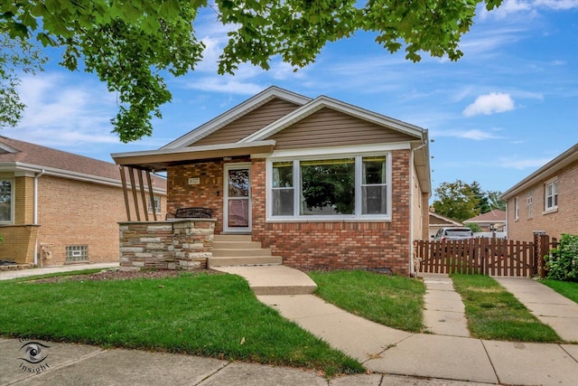 bungalow with a front yard