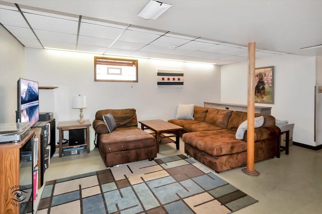 living room featuring a drop ceiling