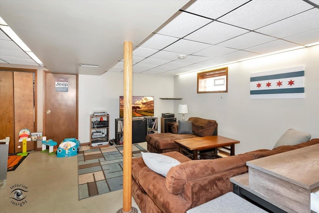 living room with a paneled ceiling