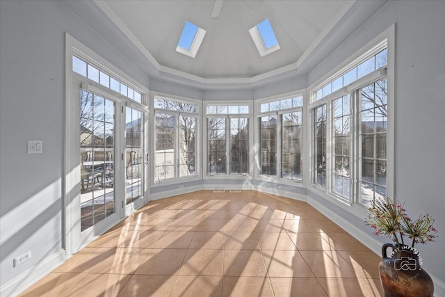 unfurnished sunroom featuring a skylight