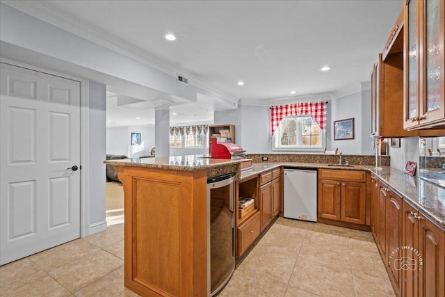 kitchen with kitchen peninsula, dark stone counters, dishwasher, and ornamental molding