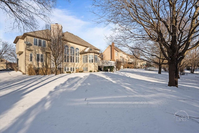 view of snow covered property