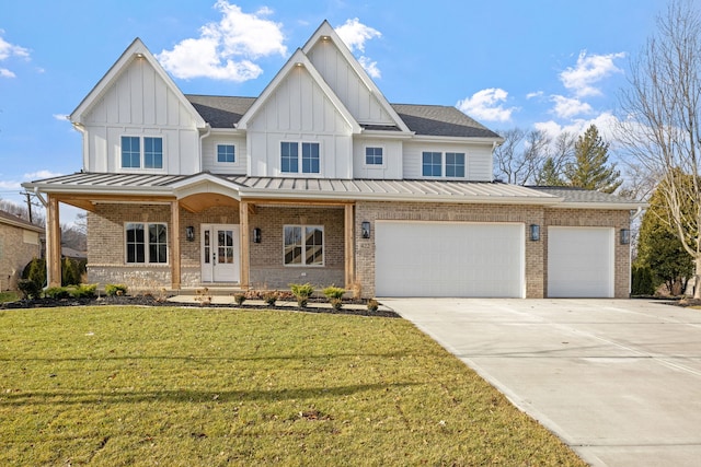 view of front of home featuring a front lawn, covered porch, and a garage