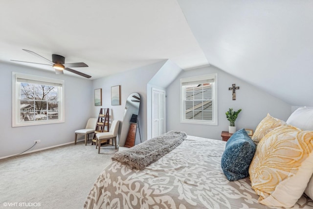 bedroom featuring a closet, ceiling fan, vaulted ceiling, and carpet