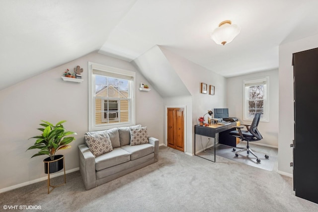 carpeted office space featuring vaulted ceiling and a wealth of natural light