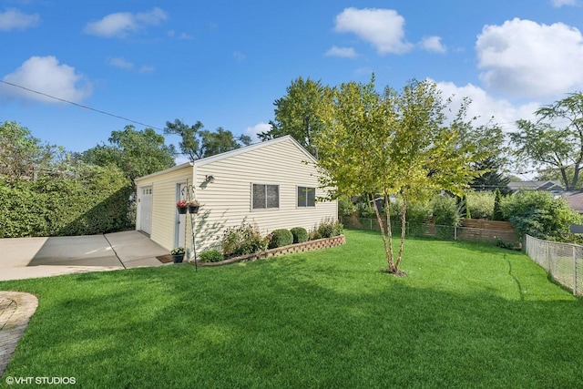 view of side of property with a lawn