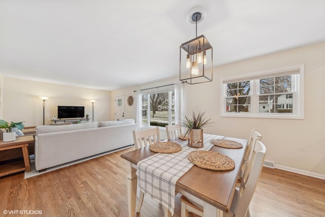 dining area with light hardwood / wood-style flooring