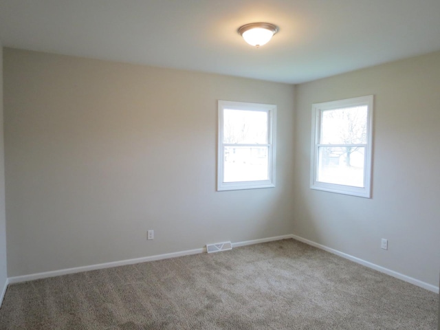 unfurnished room with carpet