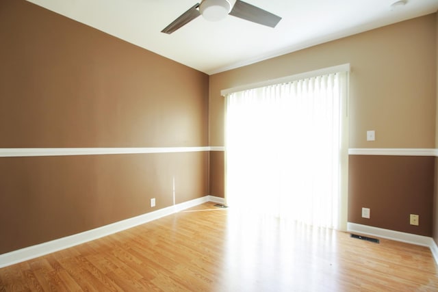 spare room with ceiling fan and light hardwood / wood-style flooring