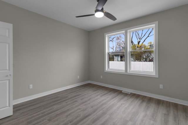 unfurnished room featuring hardwood / wood-style floors and ceiling fan