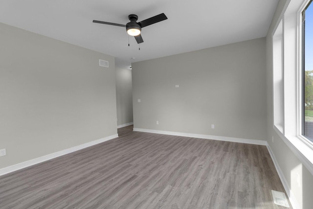 unfurnished room featuring ceiling fan and light hardwood / wood-style floors